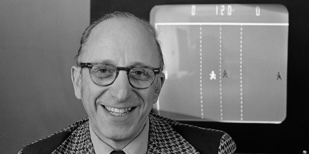 Ralph Baer an engineer for Sanders Associates, Inc., of Nashua, New Hampshire, watches his TV hockey game in this double exposure, February 3, 1977. Baer is responsible for millions of Americans frantically twisting knobs of frustration to move paddles of light in pursuit of targets of futility across their TV screens. (AP Photo)